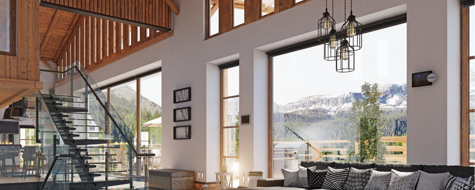 Mountain-modern Lake Tahoe home with floor-to-ceiling windows and snowy peaks